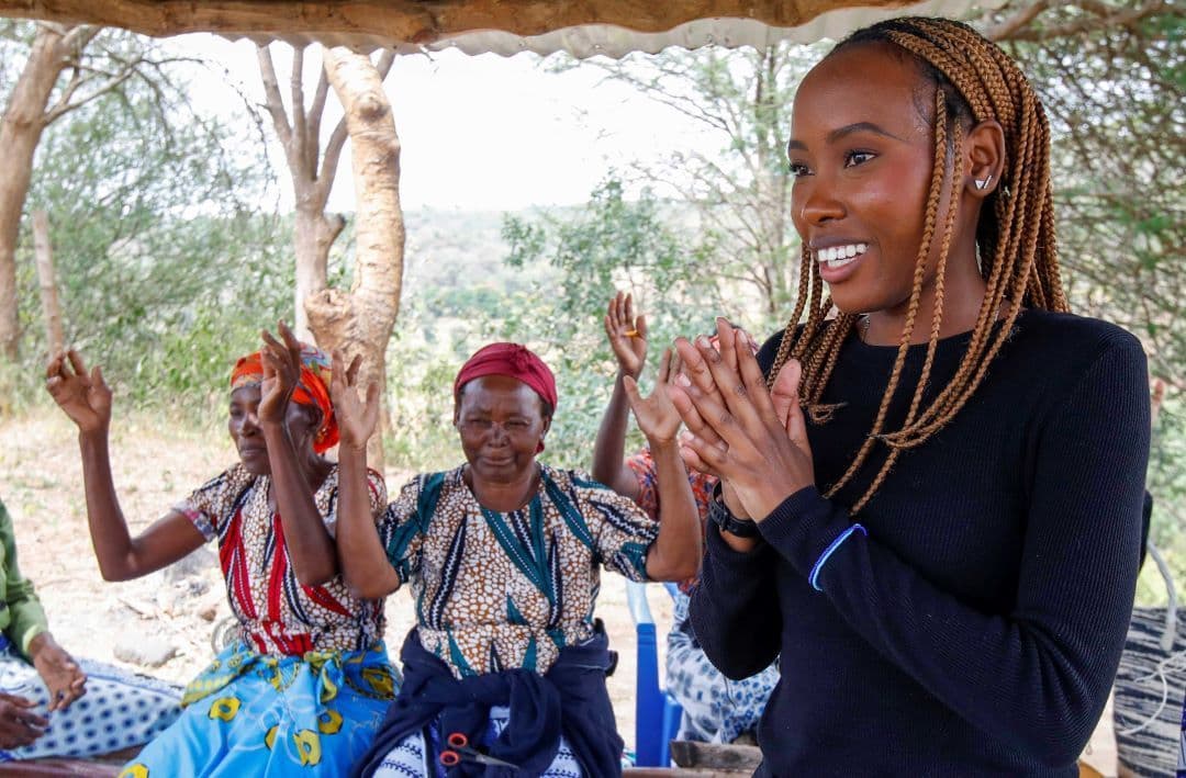 Gloria Kisilu interacting with members of Mwende Munyanya Women's Group in Katangi, Kenya