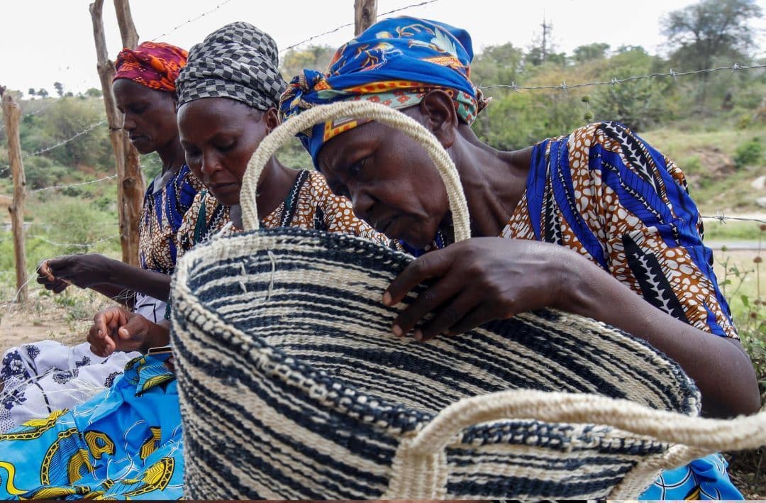 Members of Mwende Munyanya Women's Group weaving sisal baskets in Katangi, Kenya.